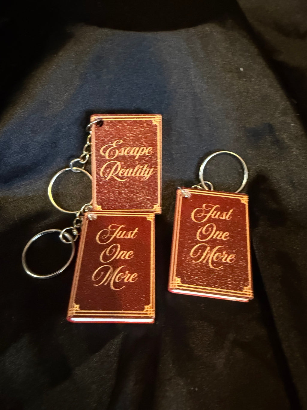 3D printed book can opener keychains, assorted titles