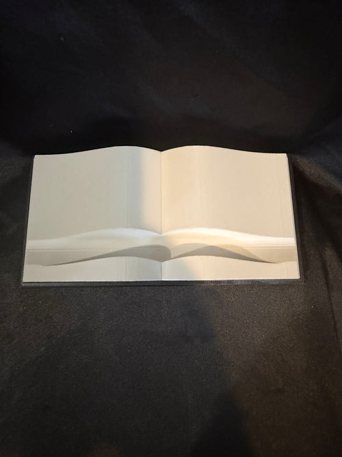 3D printed book-shaped Kindle and phone holder front view