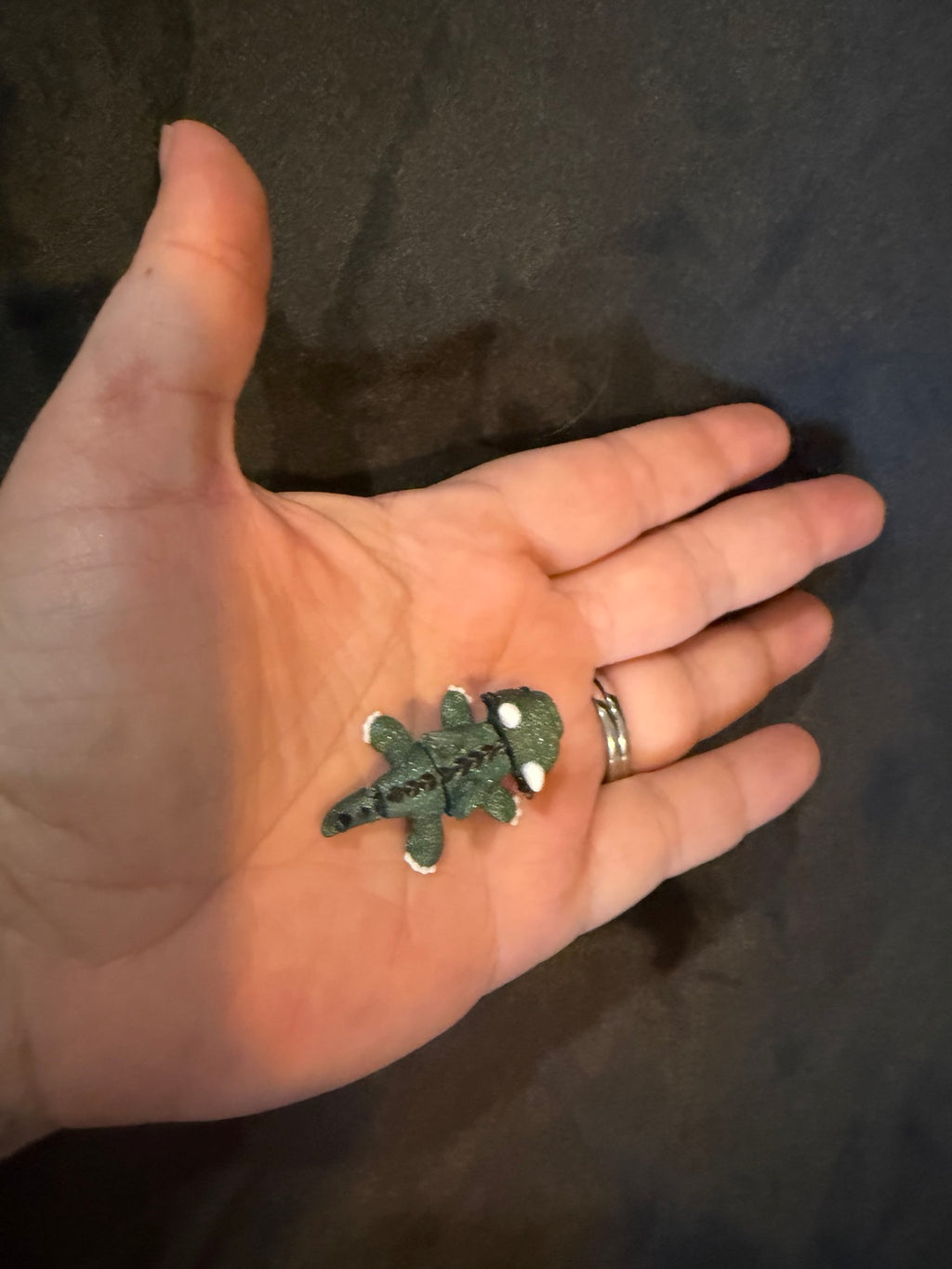 Mini 3D printed dragon fidget in hand