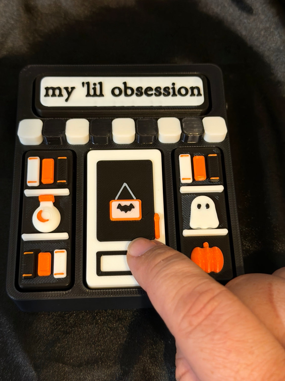 Close-up of My Lil Obsession Halloween bookstore four-area clicker