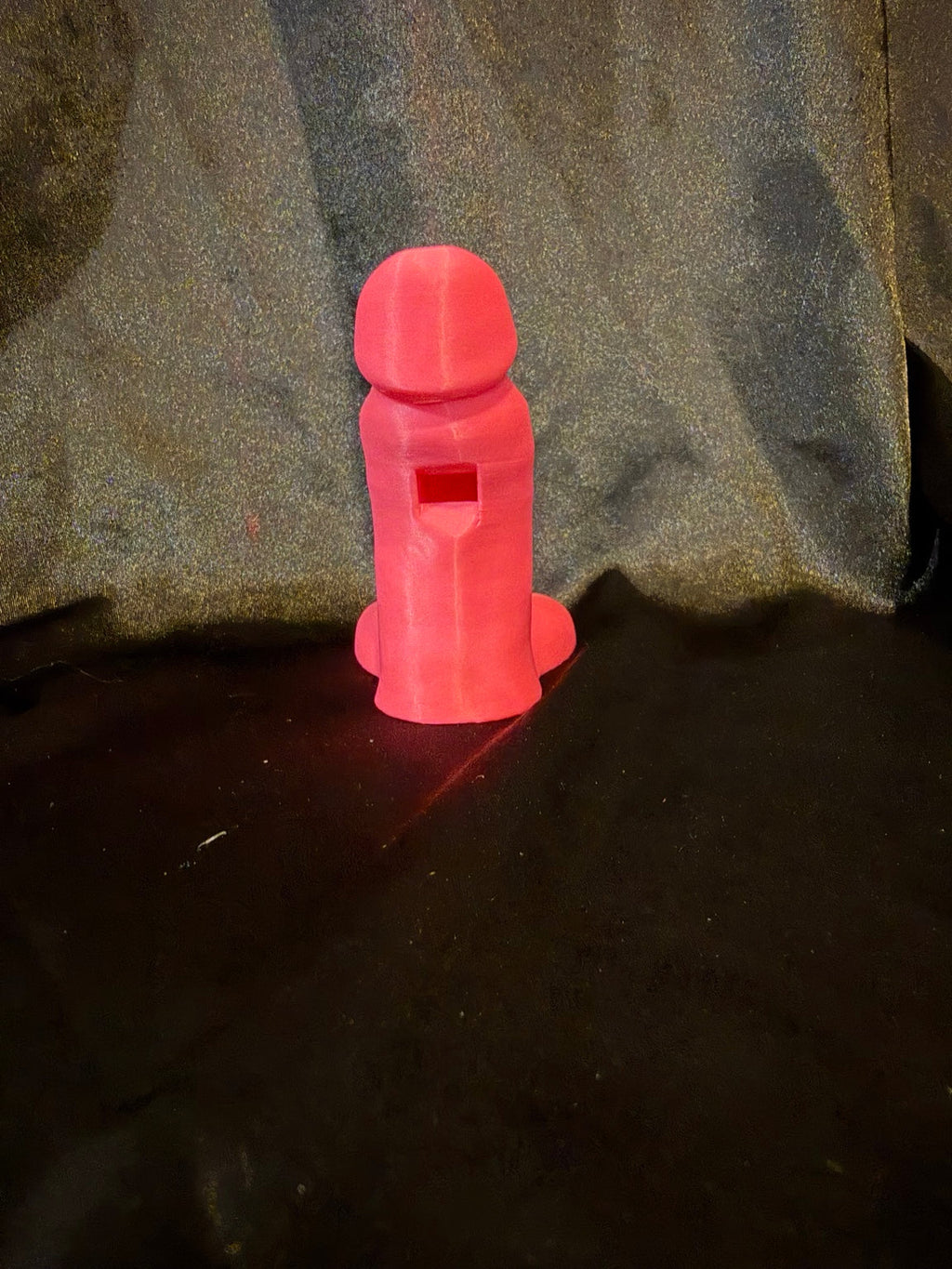 Pink novelty penis whistle back showing whistle opening