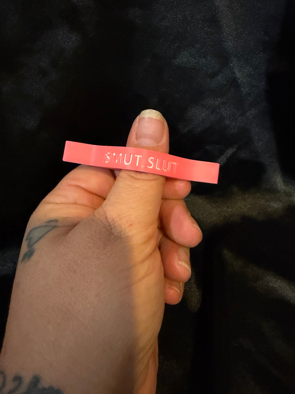 Pink Smut Slut thumb page holder closeup